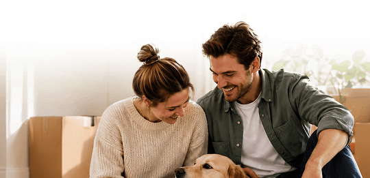 Couple relaxing at home with their dog